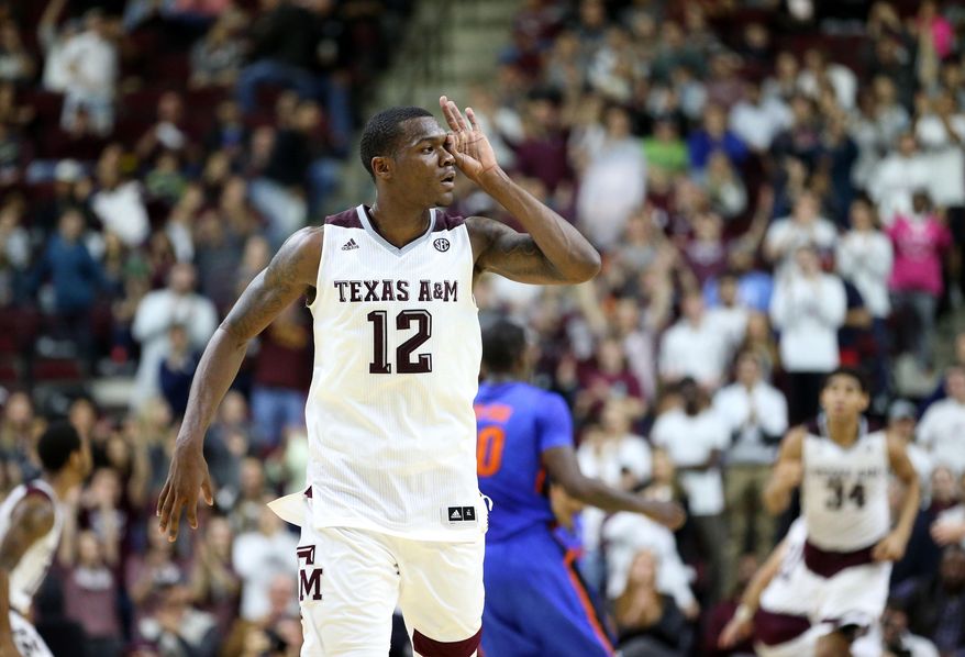 Texas A&amp;amp;M&#x27;s Jalen Jones (12) makes a three point gesture over his eye after hitting a three point basket at the buzzer of the first half of an NCAA college basketball game against Florida, Tuesday, Jan. 12, 2016, in College Station, Texas.  (AP Photo/Sam Craft)