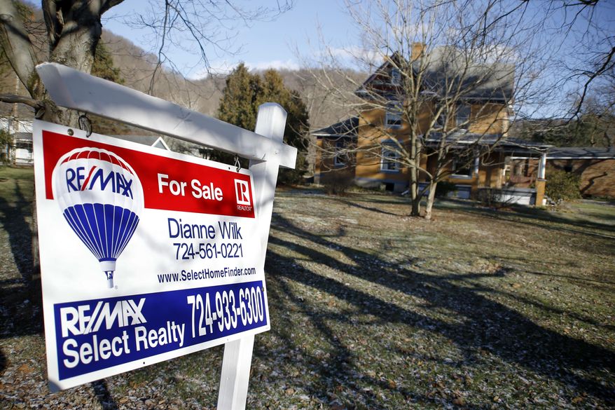 A realtor sign in front of the house used as the home of psychotic killer Buffalo Bill in the 1991 film "The Silence of the Lambs" is seen on Monday, Jan. 11, 2016 in Perryopolis, Pa. Scott and Barbara Lloyd listed the house last summer, but they've dropped the asking price from $300,000 to $250,000. The three-story Victorian was the second-most clicked home on Realtor.com last year, but no serious buyers. (AP Photo/Keith Srakocic)