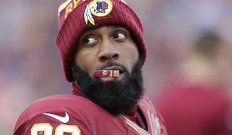 Washington Redskins cornerback DeAngelo Hall (23) looks over his shoulder as he crews on his mouth guard during the second half of an NFL football game against the Buffalo Bills in Landover, Md., Sunday, Dec. 20, 2015. (AP Photo/Mark Tenally)