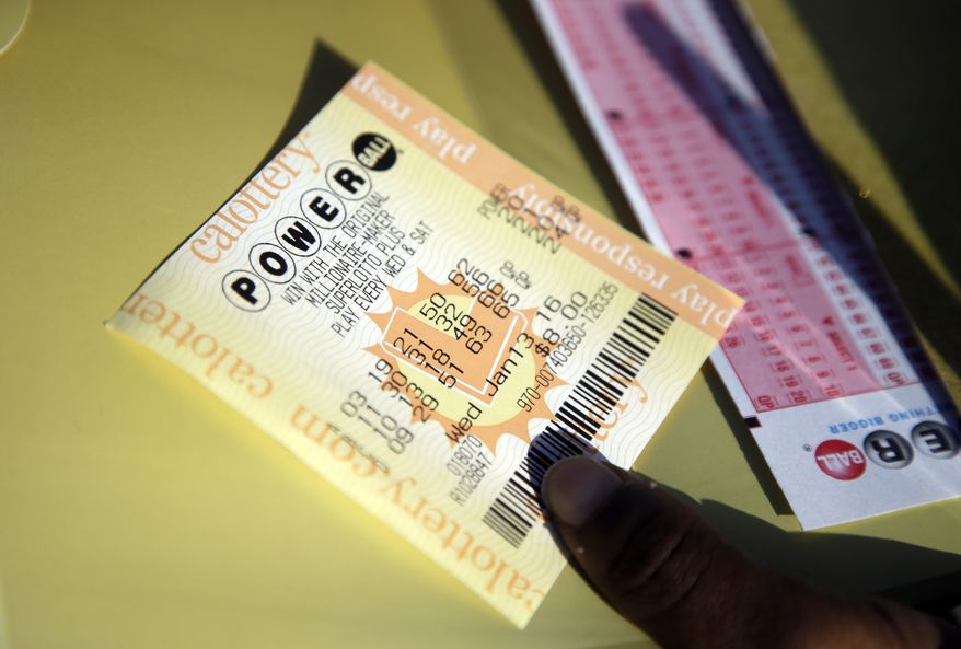 A Powerball ticket is shown Wednesday, Jan. 13, 2016, in San Lorenzo, Calif. The Powerball jackpot for Wednesday night's drawing is at least $1.5 billion, the largest lottery jackpot in the world. (AP Photo/Marcio Jose Sanchez)