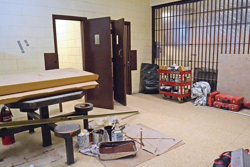 In this photo taken on Jan. 7, 2016, renovations continue at the Marquette County Jail in Marquette, Mich. Updates to the cell doors, fire alarm and camera systems, as well as the installation of an electronic locking system, are expected to be complete by spring or early summer. "Renovations haven't been done since it was built in 1976," Undersheriff Mike Klein told The Mining Journal. "We're bringing it up to code. Every cell here is being renovated." (Kelsie Thompson/Mining Journal via AP) MANDATORY CREDIT