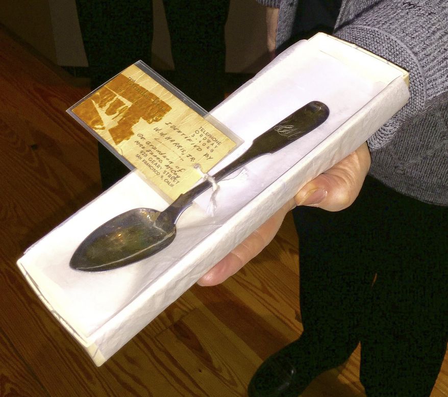 In this photo taken, Tuesday Jan. 12, 2016, a sterling silver spoon purchased around 1830 by Isaac McCoy for his wife, Christiana, is shown at the Kansas Museum of History in Topeka, Kan. The spoon belonged to one of the Kansas Territory's earliest settlers and was donated to the museum by Allin and Donna Phister and their son, Thorton, all of Leawood. The spoon belonged to one of their ancestors, Christiana McCoy. She was the wife of Baptist missionary Isaac McCoy, who history experts say was an important early settler in Kansas. (Phil Anderson/The Topeka Capital-Journal via AP) MANDATORY CREDIT
