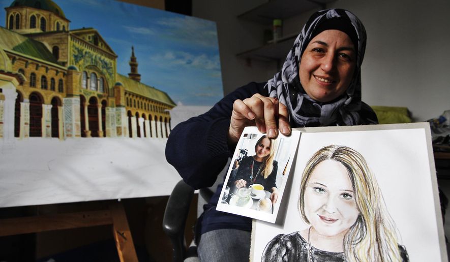 In this Thursday, Jan. 7, 2016 photo, Lina Mahameed, a Syrian artist and refugee from Daraa, holds a color portrait she drew of one of the people killed in the Nov. 13 attacks in Paris by the Islamic State extremist group, next to a photo of the victim she downloaded from the Internet, in Amman, Jordan. Mahameed hopes to send her portraits to the victims' families to show that “their tragedy is like our tragedy.” Mahameed said they fell victim to the same fanaticism that killed her 16-year-old son Yasser at the beginning of Syria’s civil war. (AP Photo/Sam McNeil)
