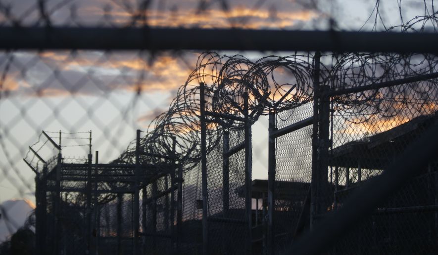 Dawn arrives at the now closed Camp X-Ray, which was used as the first detention facility for al Qaeda and Taliban militants who were captured after the Sept. 11 attacks, at Guantanamo Bay Naval Base, Cuba. (Associated Press)