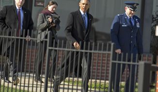 President Barack Obama, accompanied by the Commander of 89th Airlift Wing Colonel John Millard, walks toward Air Force One after a meeting with King Abdullah II bin Al-Hussein of Jordan at Andrews Air Force Base, Md., Wednesday, Jan. 13, 2016, en route to Omaha, Neb. After giving his State of the Union address, he is heading to Omaha, Neb., to tout progress and goals in his final year in office. ( AP Photo/Jose Luis Magana)