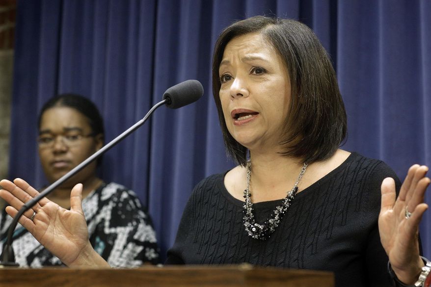 In this Wednesday, Jan. 13, 2016 photo, Illinois Sen. Iris Martinez, D-Chicago, speaks to reporters during a lawmakers news conference on home care funding, at the Illinois State Capitol Wednesday, Jan. 13, 2016, in Springfield, Ill. State officials say they won’t allow overtime pay for workers who care for disabled people in their homes after March 1. As of Jan. 1, a federal rule requires home care workers get time-and-a-half pay for work over 40 hours in a week. But without a state budget, Illinois Gov. Bruce Rauner’s administration says it can’t afford to pay and will limit workers to 35 hours a week, plus five hours for travel. (AP Photo/Seth Perlman)