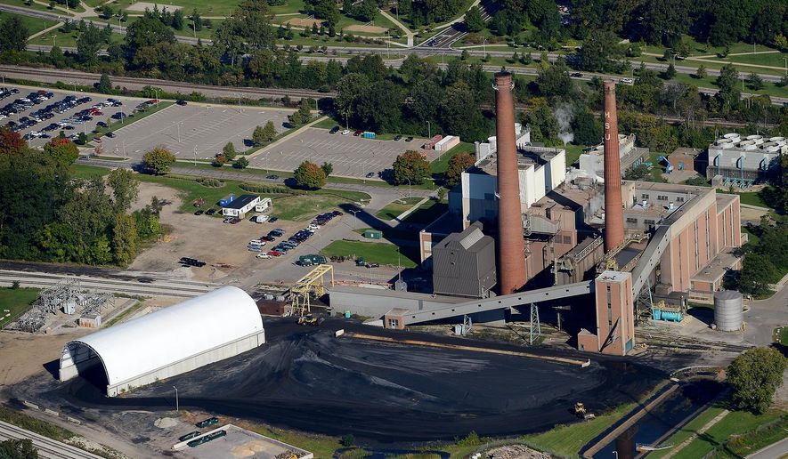 This aerial photo taken Sept. 22, 2015, shows the Michigan State University power plant in East Lansing, Mich. The plant will convert to natural gas when the coal supplies are expended, sometime this spring. (Dave Wasinger/Lansing State Journal via AP) NO SALES; MANDATORY CREDIT