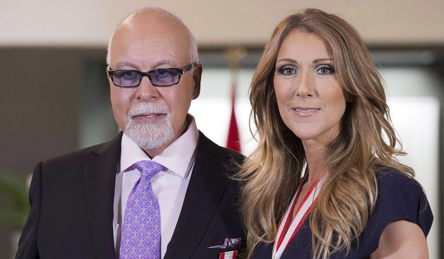 This July 26, 2013, file photo shows Canadian music star Celine Dion, right, and husband Rene Angelil posing for photos after being decorated with the Order of Canada in Quebec City. Authorities say Angelil, the husband and manager of Dion, has died in Las Vegas. He was 73 and had battled throat cancer.  Clark County Coroner John Fudenberg said his office was notified Thursday, Jan. 14, 2016, of Angelil’s death. (Jacques Boissinot/The Canadian Press, File)