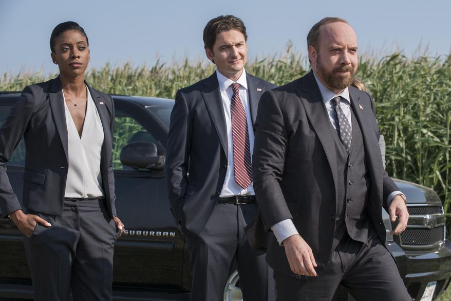 This photo provided by Showtime shows, Condola Rashad, from left, as Kate Sacker, Toby Leonard Moore as Bryan Connerty and Paul Giamatti as Chuck Rhoades in season one of the TV series, "Billions." The television show premieres Sunday, Jan. 17, 2016, at 10 p.m. EST. (Jeff Neumann/Showtime via AP)