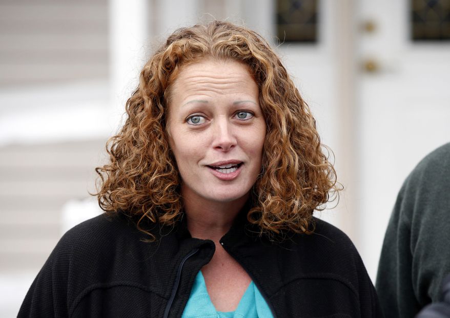 FILE - In this Oct. 31, 2014 file photo, nurse Kaci Hickox speaks to the media outside her home in Fort Kent, Maine. On Friday, Jan. 15, 2016, lawyers for New Jersey Gov. Chris Christie and state health officials have asked a judge to throw out a lawsuit from the nurse who sharply criticized being quarantined at a hospital because she had contact with Ebola patients in West Africa in 2014. (AP Photo/Robert F. Bukaty, File)