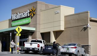 Shoppers leave the Wal-Mart Neighborhood Market in Dallas, Friday, Jan. 15, 2016. The Bentonville, Ark., company announced Friday the planned closure of 269 stores, more than half of them in the U.S. and another big chunk in its challenging Brazilian market. (Andy Jacobsohn/The Dallas Morning News via AP) MANDATORY CREDIT; MAGS OUT; TV OUT; INTERNET USE BY AP MEMBERS ONLY; NO SALES