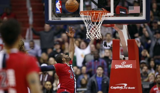 Washington Wizards guard John Wall (2) misses a last second shot in the second half of an NBA basketball game against the Boston Celtics, Saturday, Jan. 16, 2016, in Washington. The Celtics won 119-117. (AP Photo/Alex Brandon)