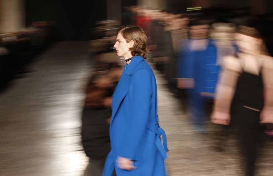 Models wear creations for Costume National Homme men's Fall-Winter 2016-2017 collection, part of the Milan Fashion Week, unveiled in Milan, Italy, Saturday, Jan. 16, 2016. (AP Photo/Antonio Calanni)