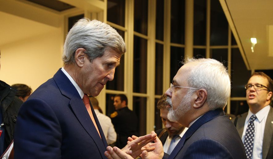 U.S. Secretary of State John Kerry talks with Iranian Foreign Minister Mohammad Javad Zarif, right, after the International Atomic Energy Agency (IAEA) verified that Iran has met all conditions under the nuclear deal, in Vienna, Saturday Jan. 16,  2016. (Kevin Lamarque/Pool via AP) ** FILE **