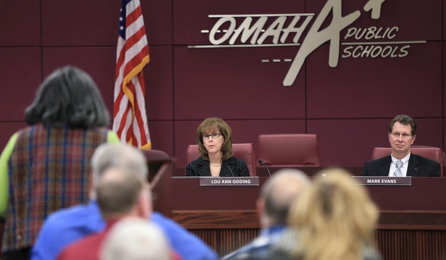 ADVANCE FOR USE MONDAY, JAN. 18, 2015 AND THEREAFTER - In this Jan. 4, 2016 photo, Omaha Public Schools board President Lou Ann Goding and OPS superintendent Mark Evans listen to public comments during a meeting in Omaha, Neb., on plans to update the district's sex education curriculum for the first time in 30 years. Sex education in the U.S. has a long and checkered history, winning the backing of the U.S. Public Health Service in 1940, gaining traction in the 1980s during the early years of the AIDS epidemic, but generating steady opposition from social conservatives. (AP Photo/Nati Harnik)