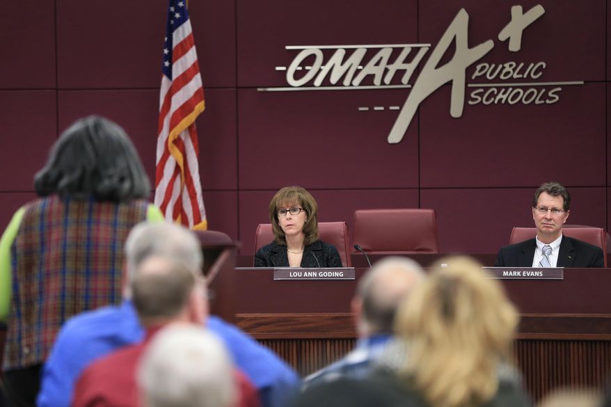 ADVANCE FOR USE MONDAY, JAN. 18, 2015 AND THEREAFTER - In this Jan. 4, 2016 photo, Omaha Public Schools board President Lou Ann Goding and OPS superintendent Mark Evans listen to public comments during a meeting in Omaha, Neb., on plans to update the district's sex education curriculum for the first time in 30 years. Sex education in the U.S. has a long and checkered history, winning the backing of the U.S. Public Health Service in 1940, gaining traction in the 1980s during the early years of the AIDS epidemic, but generating steady opposition from social conservatives. (AP Photo/Nati Harnik)