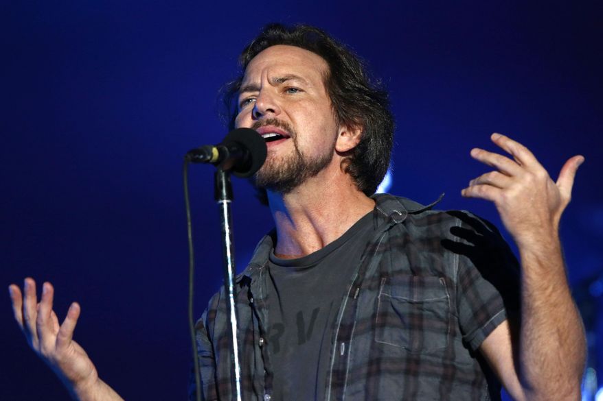 FILE - In this Sept. 26, 2015 file photo, Eddie Vedder of Pearl Jam performs at the Global Citizen Festival in New York. Pearl Jam, will join Stevie Wonder and Neil Young at this year’s New Orleans Jazz and Heritage Festival at the Fair Grounds on the weekends of April 22-24 and April 28-May 1. (Photo by Greg Allen/Invision/AP, File)