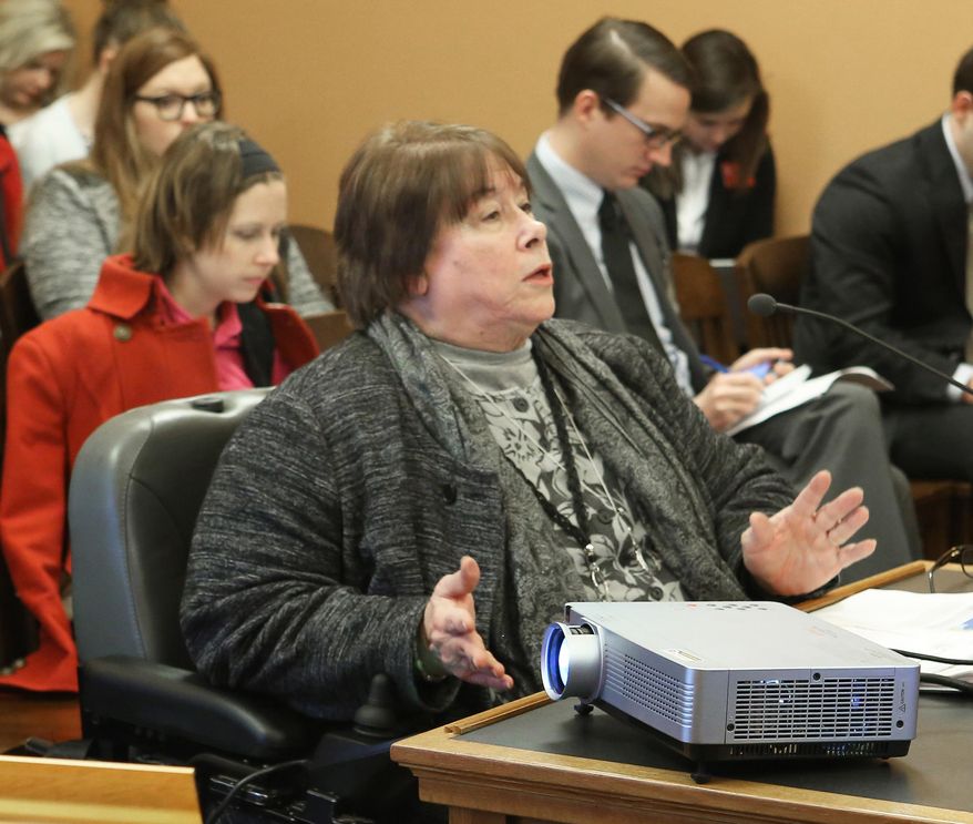 Department for Children and Families Secretary Phyllis Gilmore addresses the House Children and Seniors Committee, Tuesday, Jan. 19, 2016, in Topeka, Kan, where she spoke to them in a lengthy question-and-answer period where she vehemently pushed back against accusations of discrimination at her agency. (Thad Allton/The Topeka Capital-Journal via AP) MANDATORY CREDIT