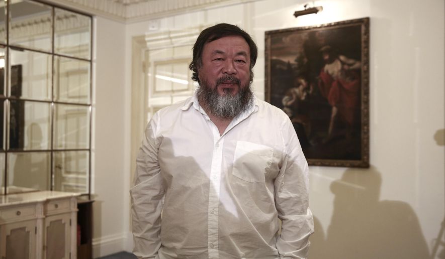 FILE-- In this Jan. 1, 2016 file photo, Chinese activist and artist Ai Weiwei poses for a photograph following a news conference in Athens. An exhibition of work by Weiwei is planned for 2017 at Frederik Meijer Gardens & Sculpture Park in western Michigan. The show titled "Ai Weiwei at Meijer Gardens: Natural, State" announced Tuesday, Jan. 19, 2016 is billed as his first at a botanic garden. (AP Photo/Yorgos Karahalis, File)