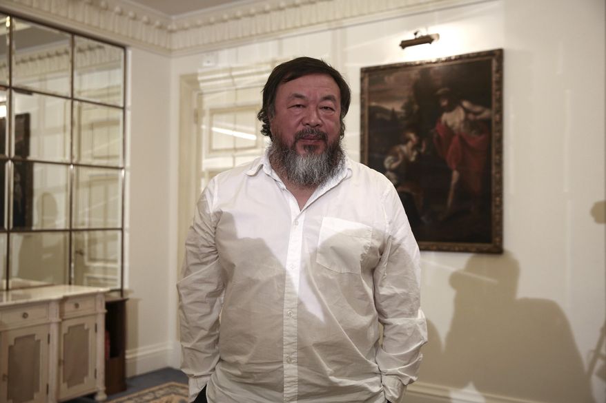 FILE-- In this Jan. 1, 2016 file photo, Chinese activist and artist Ai Weiwei poses for a photograph following a news conference in Athens. An exhibition of work by Weiwei is planned for 2017 at Frederik Meijer Gardens & Sculpture Park in western Michigan. The show titled "Ai Weiwei at Meijer Gardens: Natural, State" announced Tuesday, Jan. 19, 2016 is billed as his first at a botanic garden. (AP Photo/Yorgos Karahalis, File)