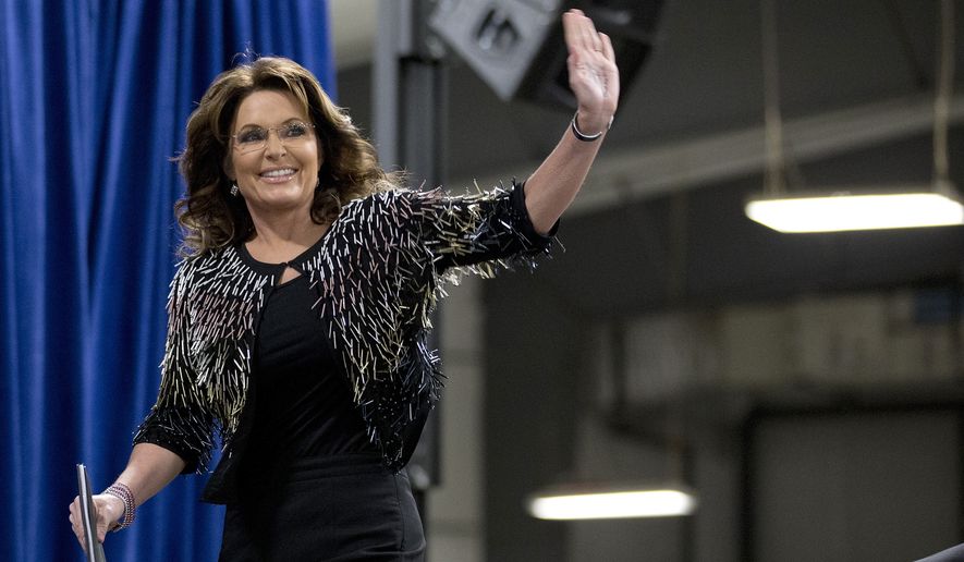 Former Alaska Gov. Sarah Palin waves as she arrives on stage to endorse Republican presidential candidate Donald Trump during a rally at the Iowa State University, Tuesday, Jan. 19, 2016, in Ames, Iowa. (AP Photo/Mary Altaffer) ** FILE **