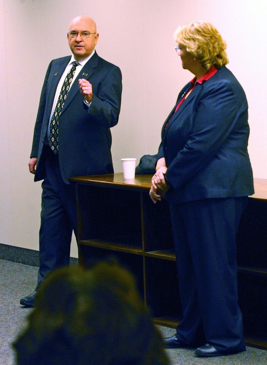 Fuller Cowell, left, new publisher of the Fairbanks Daily News-Miner in Fairbanks, Alaska, speaks during an employee meeting Tuesday, Jan. 19, 2016. The News-Miner was recently purchased by the Helen E. Snedden Foundation. Foundation executive director Virginia Farmier listens at right. (Eric Engman/Fairbanks Daily News-Miner via AP)
