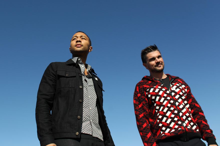 John Legend, left, and Colombian rock star Juanes arrive to perform in front of a detention center in Eloy, Arizona, Wednesday, Jan. 20, 2016. The artists performed in front of some 250 people in protest against massive migrant deportations as part of the Legends' campaign #FREEAMERICA. (AP Photo/Ricardo Arduengo)