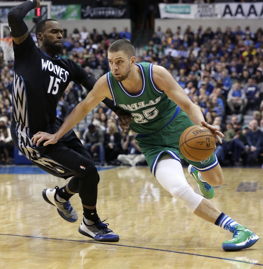 Dallas Mavericks forward Chandler Parsons (25) drives against Minnesota Timberwolves forward Shabazz Muhammad (15) during the second half of an NBA basketball game Wednesday, Jan. 20, 2016, in Dallas. The Mavericks won 106-94 in overtime. (AP Photo/LM Otero)