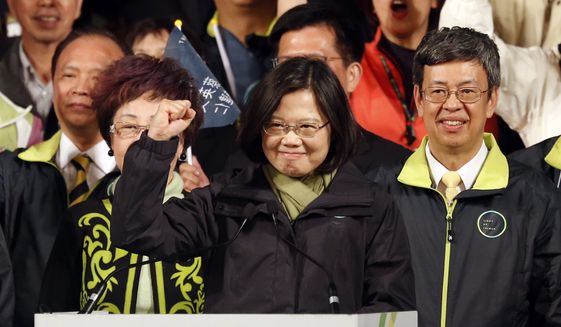 In this Saturday, Jan. 16, 2016 photo, Taiwan&#39;s Democratic Progressive Party, DPP, presidential candidate Tsai Ing-wen raises her hand as she declares victory in the presidential election, in Taipei, Taiwan. (AP Photo/Wally Santana, FIle)
