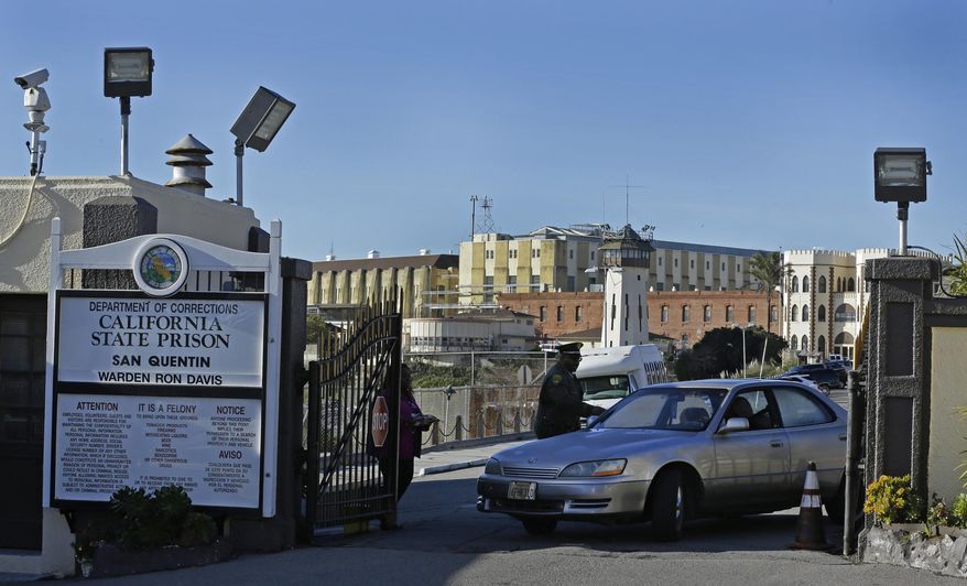 File - In this Dec. 29, 2015 file photo, a guard checks identification of a person leaving the east gate of San Quentin State Prison in San Quentin, Calif. The prison is the site of the state's lethal injection facility. Californians are preparing to decide whether to resume executions that stopped a decade ago or end them entirely. But while advocates push to put both choices before voters this year, officials overseeing the 746 condemned inmates on the nation's largest death row are moving ahead with plans to use a single lethal drug amid a nationwide shortage of execution drugs. (AP Photo/Ben Margot, File)