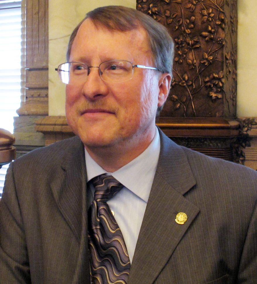File-This May 9, 2011, file photo shows Kansas House Pensions and Benefits Committee Chairman Mitch Holmes, a St. John Republican, at the Statehouse in Topeka, Kan. A dress code imposed by Holmes, a Kansas Senate committee chairman, prohibits women testifying on bills from wearing low-cut necklines and miniskirts is drawing bipartisan ridicule from female legislators. Holmes' 11-point code of conduct does not include any restrictions on men, who he said needed no instruction on how to look professional, The Topeka Capital-Journal reported. (AP Photo/John Hanna,File)