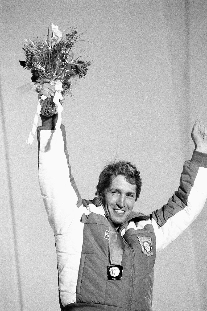 FILE - In this Feb. 16, 1984 file photo, Bill Johnson raises his arms into the air to celebrate his gold medal in the mens Olympic downhill in Sarajevo, Bosnia and Herzegovina. The U.S. ski team says the former Olympic downhill champion has died after a long illness. He was 55. Megan Harrod, a spokeswoman for the U.S. Alpine team, says Johnson died Thursday, Jan. 21, 2016 at an assisted living facility in Gresham, Ore. (AP Photo/Michel Lipchitz, File)