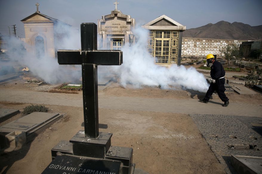 A health worker fumigates to prevent Dengue, Chikunguya and Zika virus, at El Angel cemetery, in Lima, Peru, Wednesday, Jan. 20, 2016. A U.S. warning urging pregnant women to avoid travel to Latin American countries where the mosquito-borne virus is multiplying threatens to depress tourism to the region, one of its few bright spots at a time of deep economic pain. (AP Photo/Martin Mejia)