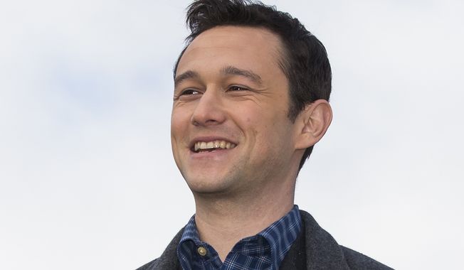 In this Oct. 8, 2015, file photo, actor Joseph Gordon-Levitt poses for the media on top of the Empire Tower before the premiere of &quot;The Walk&quot; at the Moscow International Business Center, Russia. (AP Photo/Alexander Zemlianichenko, File)