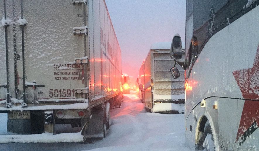 In this photo provided by Dave Saba, traffic is at a standstill on the Pennsylvania Turnpike near Somerset, Pa., Saturday, Jan. 23, 2016. The Duquesne men's basketball team and Temple University's women's gymnastics team are stuck on the Turnpike due to a treacherous weather conditions. A mammoth winter storm crawled up the U.S. East Coast Saturday, making roads impassable, shutting down mass transit, and bringing Washington and New York City to a standstill. (Dave Saba via AP)