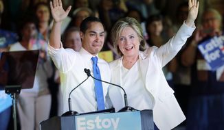 In this Oct. 15, 2015, file photo, Democratic presidential candidate Hillary Clinton, right, stands with Housing and Urban Development Secretary Julian Castro, left, after she was introduced during a campaign event in San Antonio. Clinton hasn&#39;t just been wrapping herself in President Barack Obama&#39;s legacy lately. She&#39;s been wrapping herself in his Cabinet. (AP Photo/Eric Gay, File)
