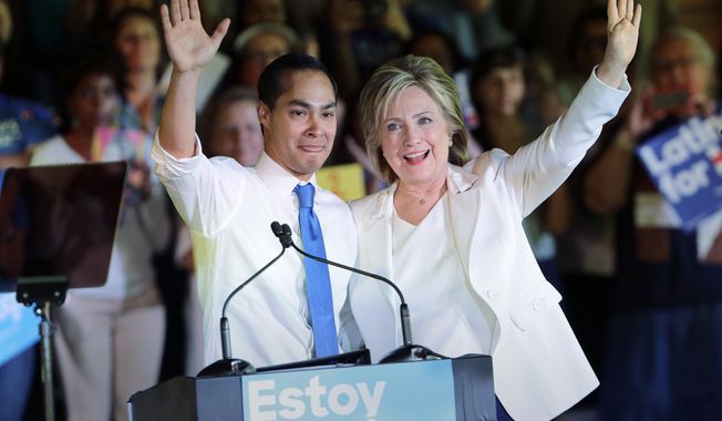 In this Oct. 15, 2015, file photo, Democratic presidential candidate Hillary Clinton, right, stands with Housing and Urban Development Secretary Julian Castro, left, after she was introduced during a campaign event in San Antonio. Clinton hasn&#x27;t just been wrapping herself in President Barack Obama&#x27;s legacy lately. She&#x27;s been wrapping herself in his Cabinet. (AP Photo/Eric Gay, File)