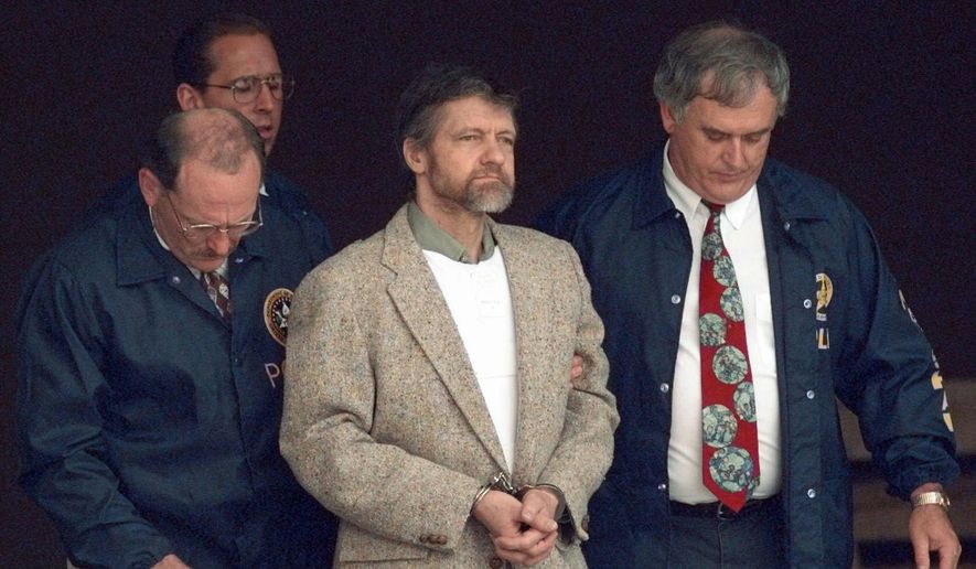 In this June 21, 1996, file photo, Theodore Kaczynski looks around as U.S. marshals prepare to take him down steps at the federal courthouse to a waiting vehicle in Helena, Mont. In handwritten letters to hundreds of supporters and curiosity seekers, Kaczynski expressed shock over the 9/11 attacks and wrote that he preferred Hillary Clinton over Barack Obama in the 2008 Democratic presidential race. (AP Photo/Elaine Thompson, File)