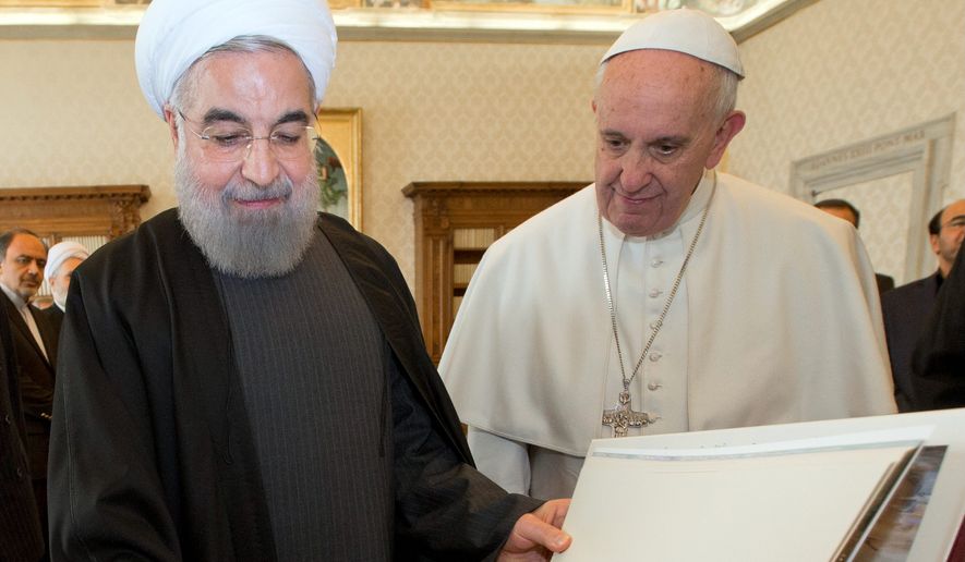 Meeting of the minds: Iranian President Hassan Rouhani (left) met in private with Pope Francis at the Vatican Tuesday during a European trip aimed at positioning Tehran as a potential top player in efforts to resolve Middle East conflicts — including Syria&#39;s civil war — as Tehran&#39;s nuclear sanctions dissolve. Story, A9. (Associated Press)