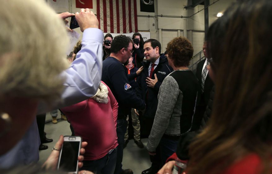 In this Jan. 21, 2016, photo Republican presidential candidate, Sen. Marco Rubio, R-Fla., talks with Bob Belanger, from Brookline, N.H., after a campaign stop at a welding company in Brookline. Illegal immigration is a paramount concern to New Hampshire voters, and Republican presidential candidates are being faced with tough questions from voters in this small, mostly white, state on how they will handle the issue if elected. Belanger said immigration concerns among New Hampshire residents do not equate to xenophobia. (AP Photo/Charles Krupa)