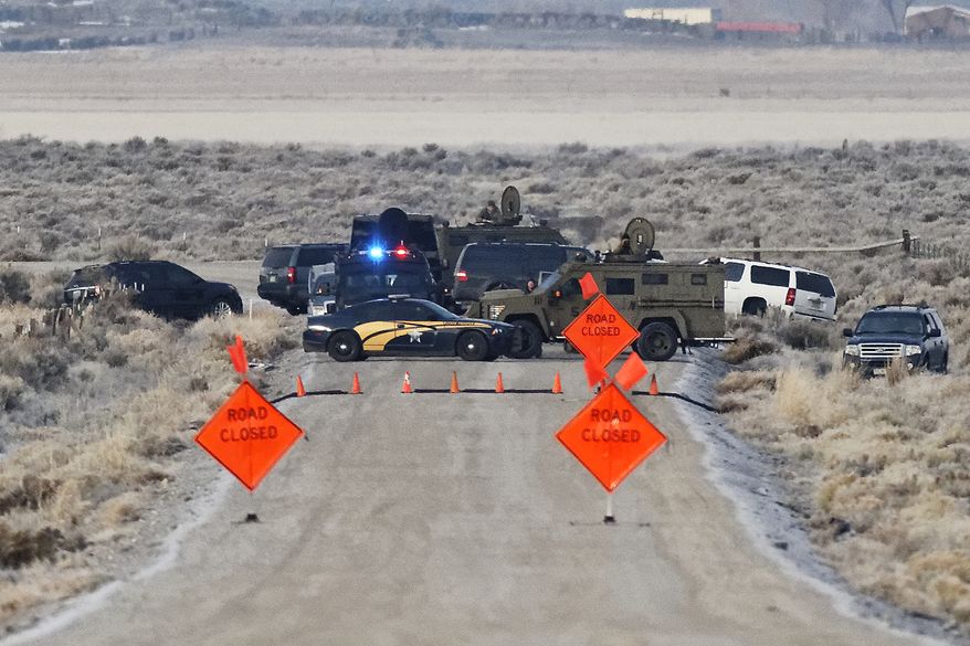 Law enforcement personnel block an access road to the Malheur National Wildlife Refuge, Wednesday, Jan. 27, 2016, near Burns, Ore. Authorities were restricting access on Wednesday to the Oregon refuge being occupied by an armed group after one of the occupiers was killed during a traffic stop and eight more, including the group&#x27;s leader Ammon Bundy, were arrested. (Thomas Boyd/The Oregonian via AP) MAGS OUT; TV OUT; NO LOCAL INTERNET; THE MERCURY OUT; WILLAMETTE WEEK OUT; PAMPLIN MEDIA GROUP OUT; MANDATORY CREDIT