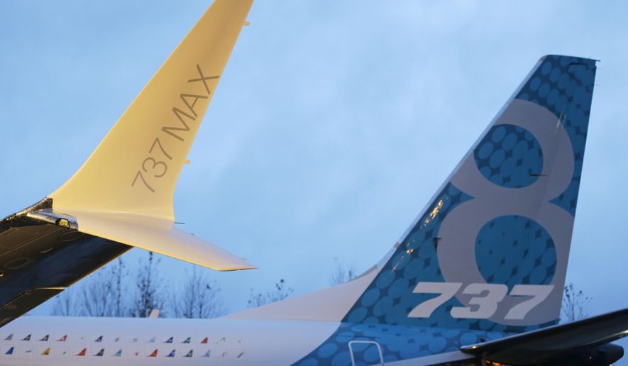 In this Tuesday, Dec. 8, 2015, photo, a winglet and the vertical stabilizer of the first Boeing 737 MAX airplane to roll off Boeing's assembly line in Renton, Wash., are shown before an employee-only rollout event. Boeing reports financial results Wednesday, Jan. 27, 2016. (AP Photo/Ted S. Warren)