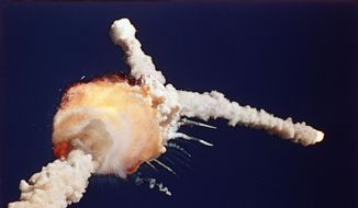 In this Jan. 28, 1986, file photo, the space shuttle Challenger explodes shortly after lifting off from the Kennedy Space Center in Cape Canaveral, Fla. (AP Photo/Bruce Weaver, File)