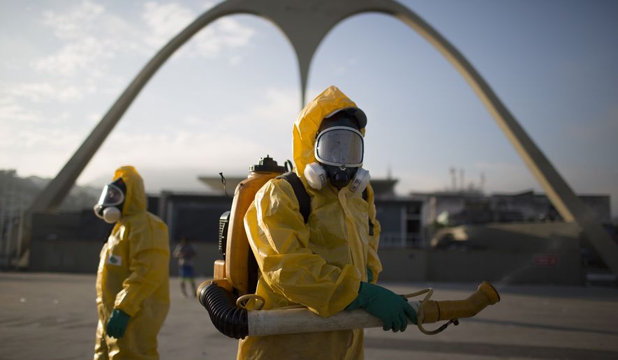 A health worker stands in the Sambadrome as he sprays insecticide to combat the Aedes aegypti mosquitoes that transmits the Zika virus in Rio de Janeiro, Brazil, Tuesday, Jan. 26, 2016. Inspectors begin to spray insecticide around Sambadrome, the outdoor grounds where thousands of dancers and musicians will parade during the city's Feb. 5-10 Carnival celebrations. Brazil's health minister says the country will mobilize some 220,000 troops to battle the mosquito blamed for spreading a virus linked to birth defects. (AP Photo/Leo Correa)