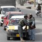 An Afghan policeman searches a passenger at a checkpoint in Kandahar, Afghanistan, Tuesday, Jan. 26, 2016. An Afghan official says that a policeman has turned his weapon on fellow police officers at a checkpoint in the country&#39;s south, killing 10 policemen. (AP Photo/Allauddin Khan)