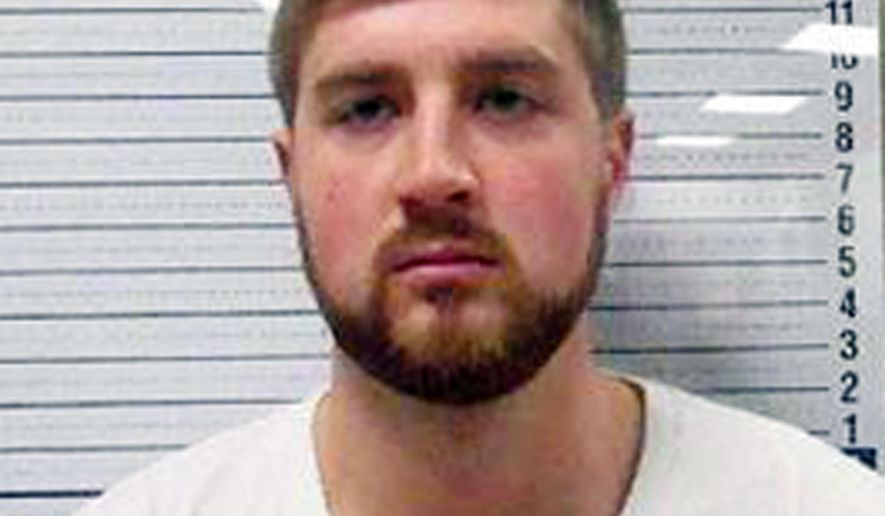 This undated booking photo provided by the Park County, Wyo., Sheriff's Office shows Scott Michael Lewis. Federal prosecutors are pressing felony charges against two Colorado men accused of operating an unregistered airplane that authorities claim was involved in a criminal enterprise. The charges follow the government's seizure nearly two years ago of the Cessna airplane after it landed at the municipal airport in Cody, Wyo. Police also confiscated over $250,000 in cash from a Cody hotel room rented by Lewis, the pilot and a passenger. (Park County Sheriff's Office/Powell Tribune via AP)