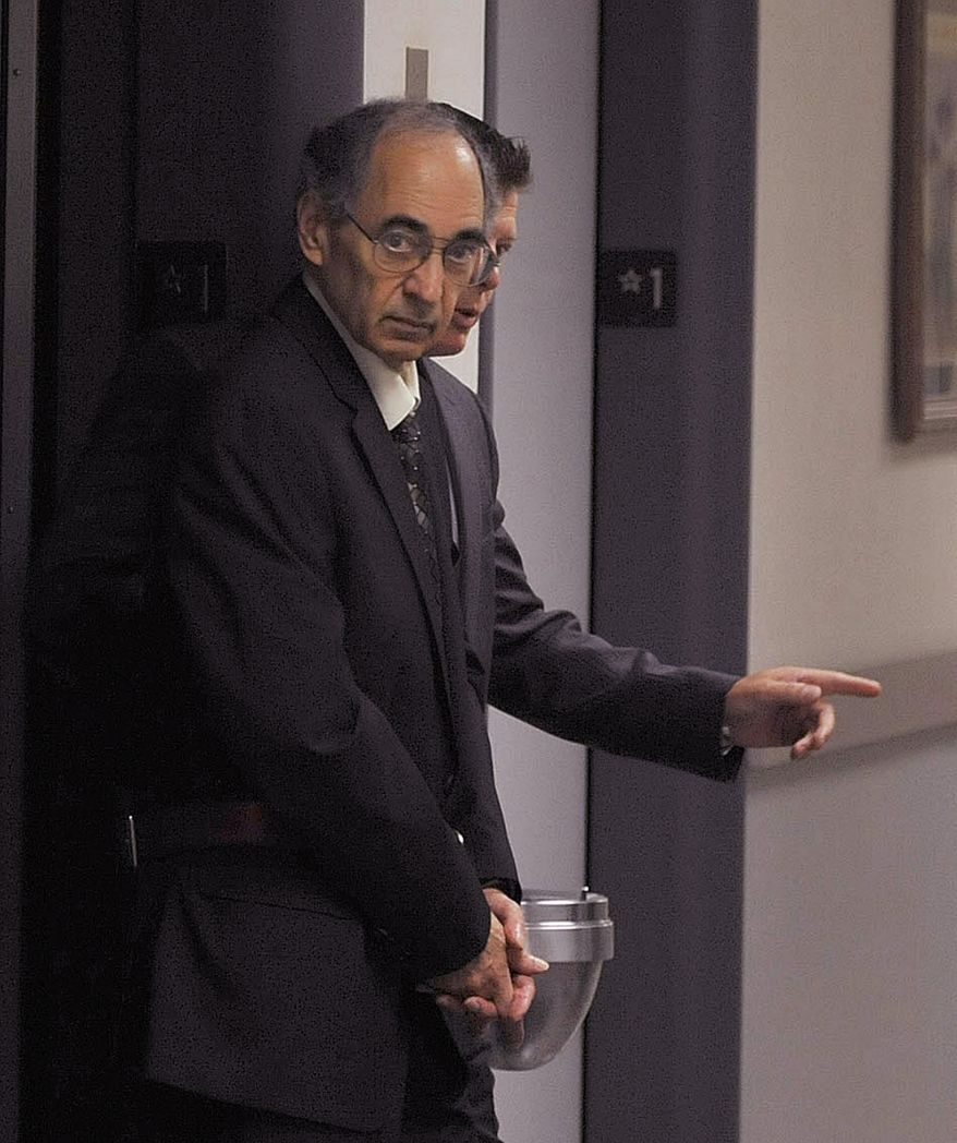 FILE - In this Sept. 9, 2015 file photo, Rev. Joseph Maurizio is led by U.S. Marshals into Federal Court for jury selection in Johnstown, Pa. On Friday, Jan. 29, 2016, a federal judge delayed the sentencing for the 70-year-old Somerset County priest who was convicted in September of having sex with poor street children during missionary trips to Honduras. The judge will instead hold a hearing on sealed motions seeking a new trial. (Todd Berkey/Tribune-Democrat via AP, File)