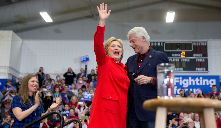 Democratic presidential candidate Hillary Clinton, accompanied by former President Bill Clinton, right, and their daughter Chelsea Clinton, left, arrives to speak at a rally at Washington High School in Cedar Rapids, Iowa, Saturday, Jan. 30, 2016. (AP Photo/Andrew Harnik) ** FILE **