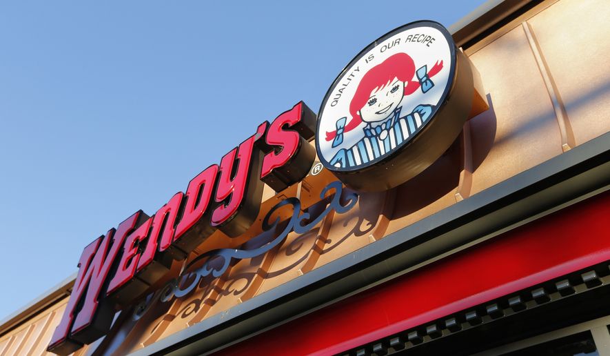This Friday, March 21, 2014, file photo, shows a Wendy's restaurant in Providence, R.I. (AP Photo/Michael Dwyer, File)