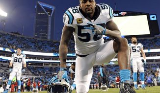 FILE - In this Jan. 24, 2016, file photo, Carolina Panthers&#39; Thomas Davis warms up before the NFL football NFC Championship game against the Arizona Cardinals in Charlotte, N.C. Panthers All-Pro linebacker Davis broke his arm in Sunday’s NFC championship game against the Cardinals but plans to play in the Super Bowl. (AP Photo/Mike McCarn, File)